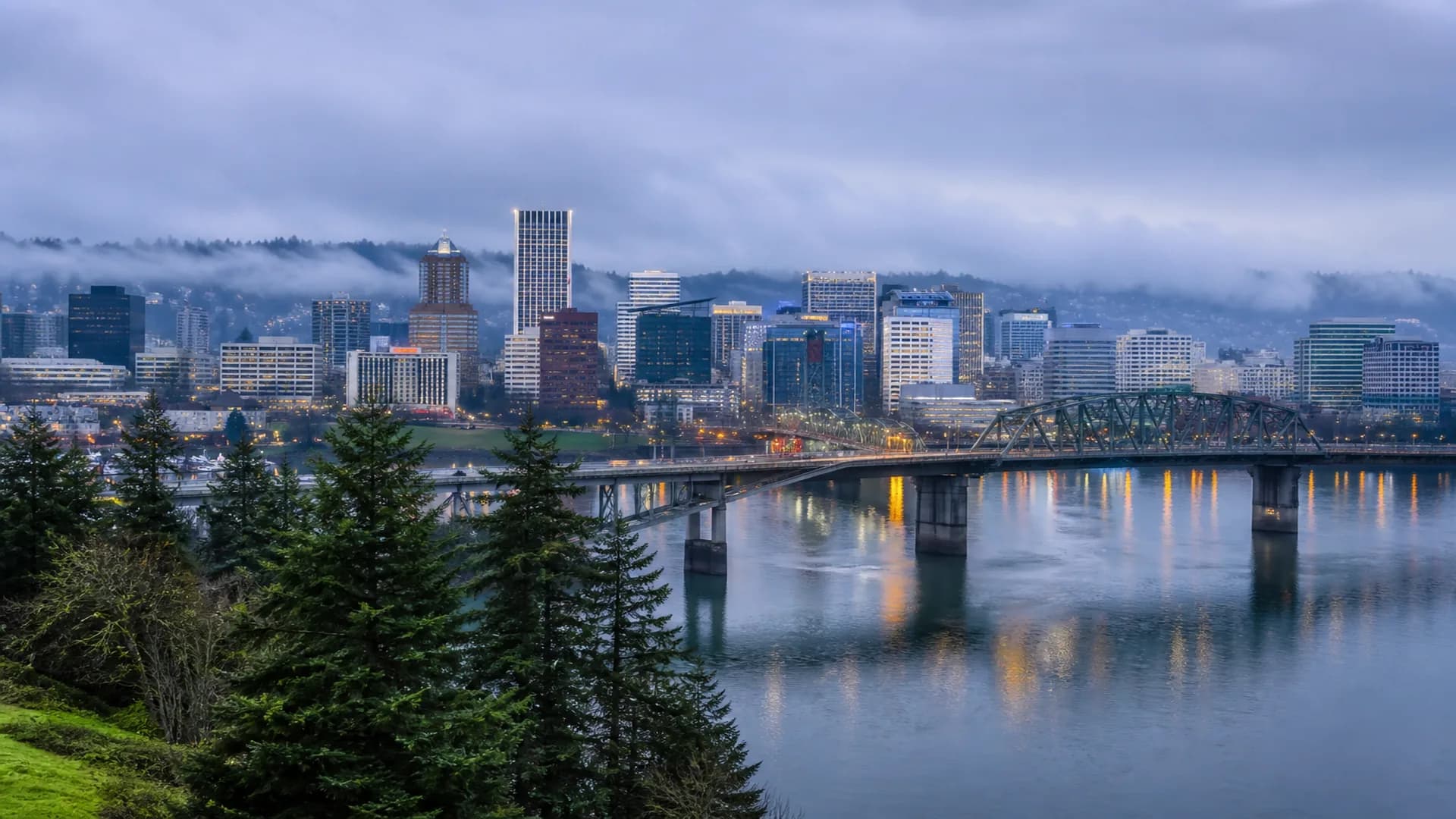 RV basecamp near Portland Oregon with evergreen hills and soft fog